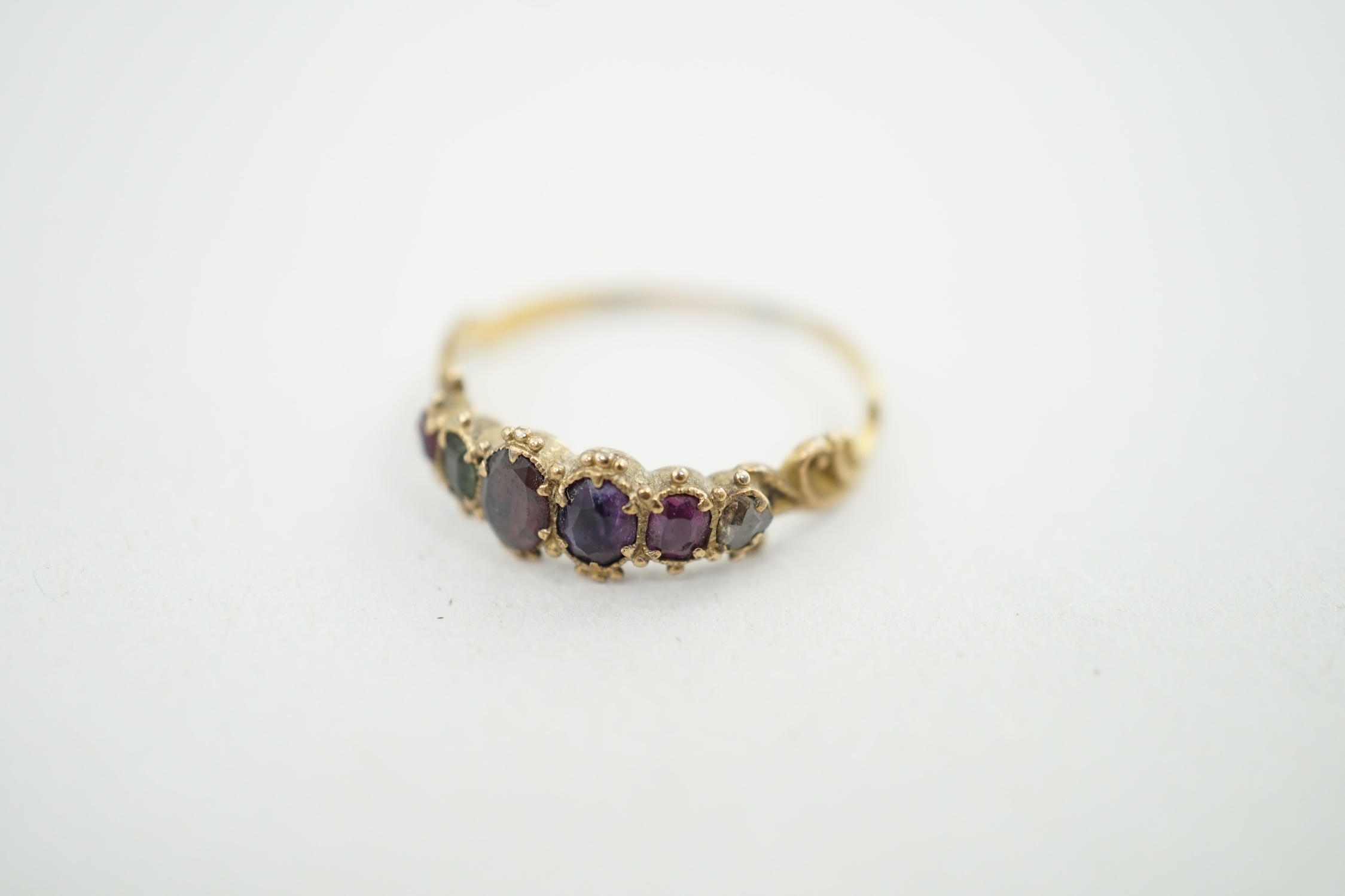 A Victorian gold and gem set 'Regard' half hoop ring